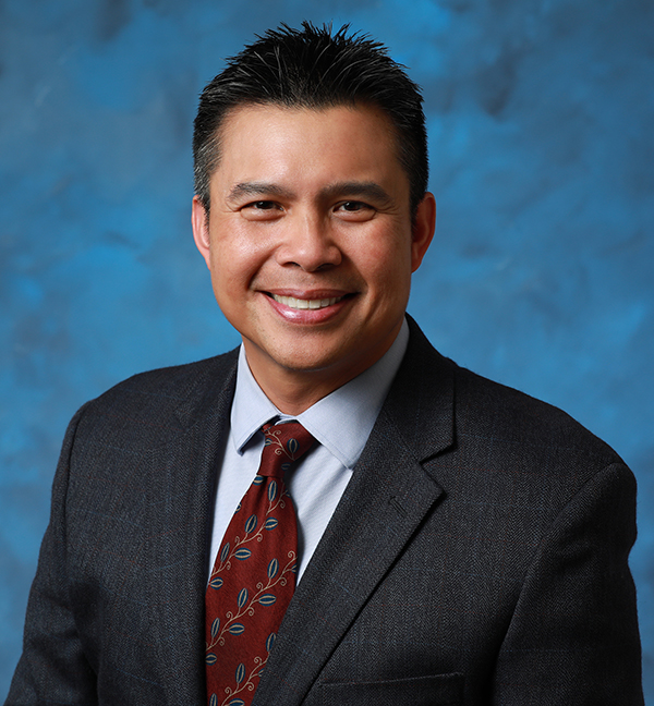 Board Member Dr. Larry Natividad